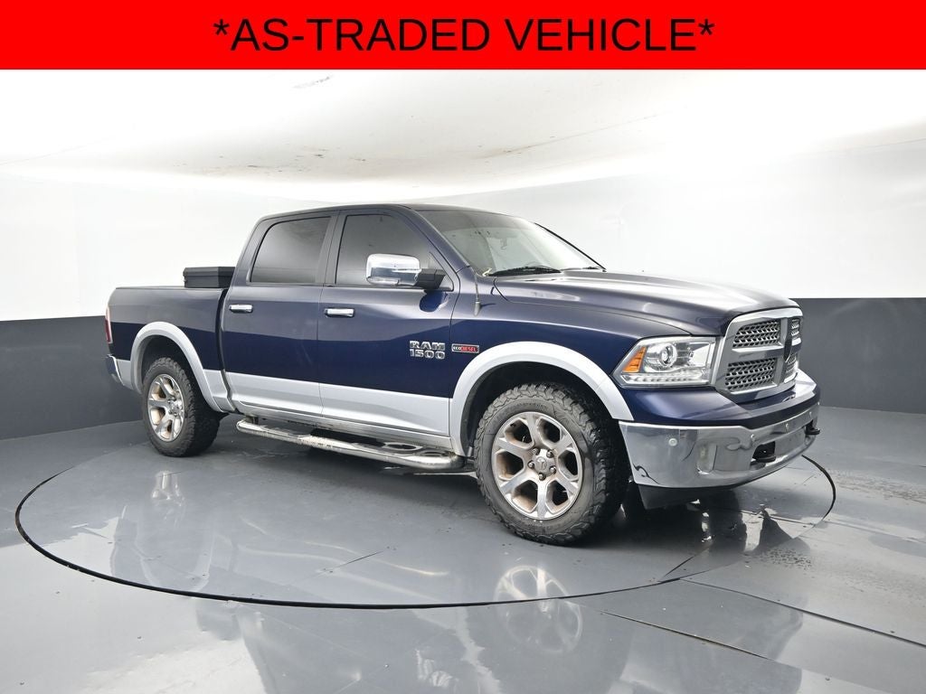 2017 RAM 1500 Laramie Crew Cab 4x4 5'7' Box in True Blue Pearlcoat — front three-quarter view