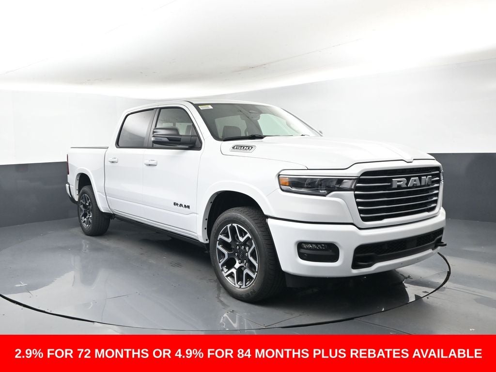 2026 RAM Ram 1500 RAM 1500 LARAMIE CREW CAB 4X4 5'7' BOX in Bright White Clear-Coat Exterior Paint — front three-quarter view