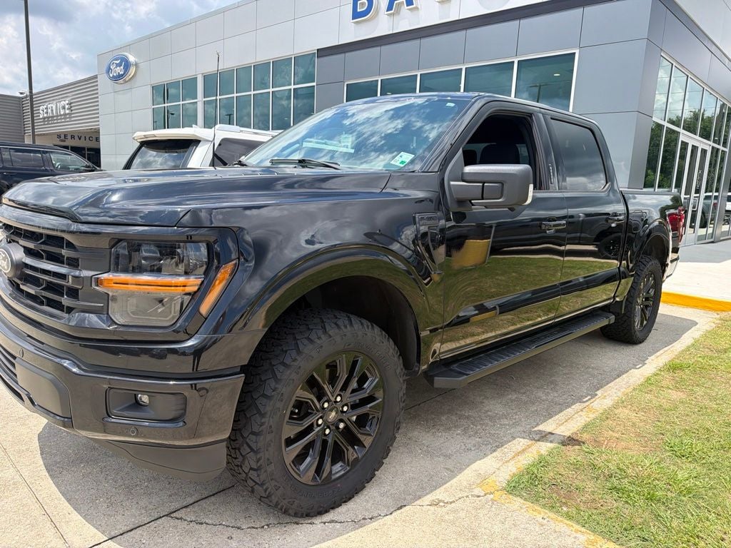2024 Ford F-150 XLT in Black Metallic — front three-quarter view