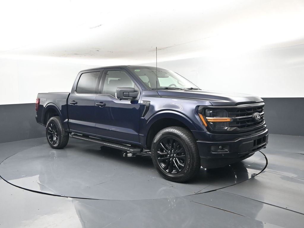2025 Ford F-150 XLT in Blue Metallic — front three-quarter view